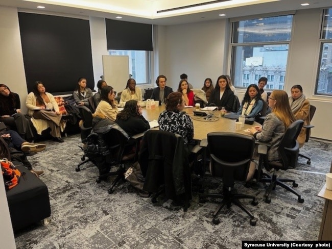 Students meet with business representatives at Syracuse University. ( Photo courtesy of Syracuse University)