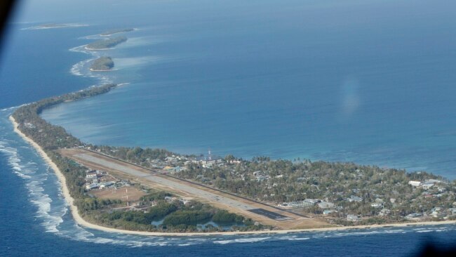 FILE - Funafuti, the main island of the nation state of Tuvalu, is photographed from a Royal New Zealand air force C130 aircraft as it approaches the tiny South Pacific nation.