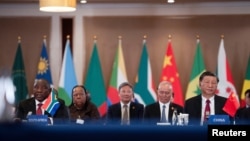 President of China Xi Jinping and South African President Cyril Ramaphosa attend the China-Africa Leaders' Roundtable Dialogue on the last day of the BRICS Summit, in Johannesburg, South Africa, Aug. 24, 2023. 