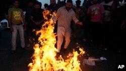 Activists of Bharatiya Janata Yuva Morcha, the youth wing of the Bharatiya Janata Party, protest against the killings of five Indian army soldiers in Jammu, India, May 5, 2023.