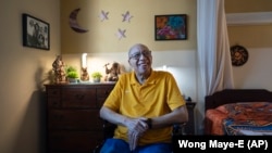 Alex Morisey listens to music in his room at a nursing home in Philadelphia, on Wednesday, Feb. 15, 2023. (AP Photo/Wong Maye-E)