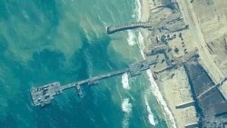 The image provided by US Central Command, shows US Army soldiers, US Navy sailors and Israel Defense Forces placing the Trident Pier on the coast of the Gaza Strip on May 16, 2024.