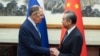 Menteri Luar Negeri Rusia Sergei Lavrov berjabat tangan dengan Menteri Luar Negeri China Wang Yi dalam pertemuan di Beijing, China, 16 Oktober 2023. (Kementerian Luar Negeri Rusia/Handout via REUTERS)
