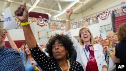 Supporters react to remarks by US President Joe Biden at Renaissance High School, July 12, 2024, during a campaign event in Detroit.