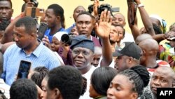 FILE: Lagos Governor and Ruling All Progressives Congress (APC) candidate to re-election Babajide Sanwo Olu (C) waves to supporters after voting at a polling station for a gubernatorial and House of Assembly candidates during local elections, in Lagos, on March 18, 2023.