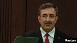 New Vice President of Turkey Cevdet Yilmaz stands during a news conference where Turkish President Tayyip Erdogan announced the new cabinet, in Ankara, Turkey June 3, 2023.