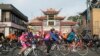 Pengendara sepeda melaju sejauh 20 mil di acara tahunan ke-45 L.A. Chinatown Firecracker dengan petasan, penari naga, di Los Angeles Sabtu, 18 Februari 2023. (AP/Damian Dovarganes)