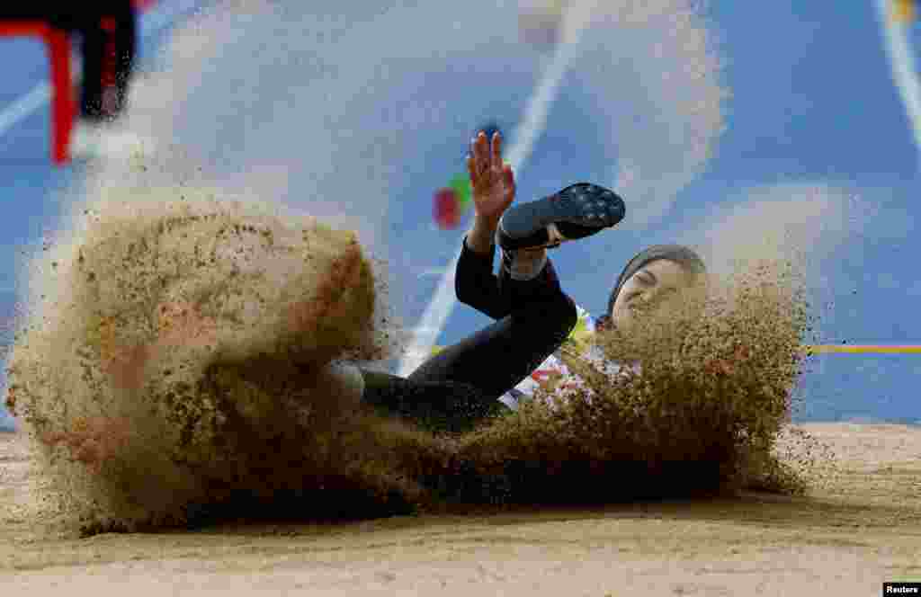 Malaysia&#39;s Nurul Ashikin Abas competes in the women&#39;s long jump during the 32nd Southeast Asian Games in Phnom Penh, Cambodia.