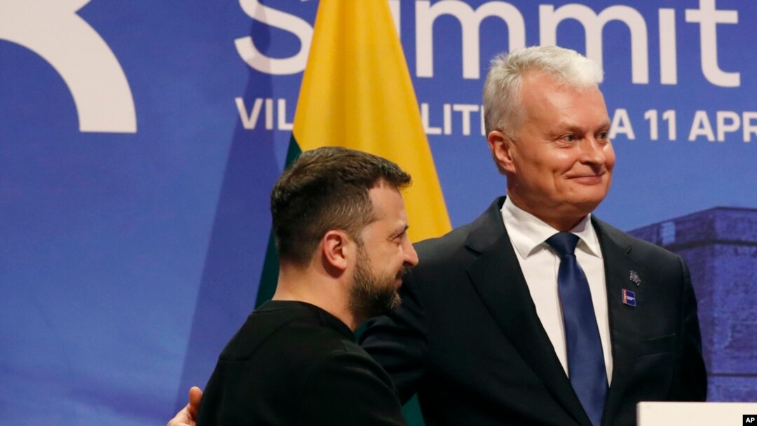 FILE - Ukraine's President Volodymyr Zelenskyy, left, stands with Lithuania's President Gitanas Nauseda after addressing a media conference in Vilnius, Lithuania, on April 11, 2024. 
