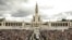FILE - Pope Francis in his popemobile leaves at the end of a Mass where he canonized shepherd children Jacinta and Francisco Marto at the Sanctuary of Our Lady of Fatima, May 13, 2017, in Fatima, Portugal. 