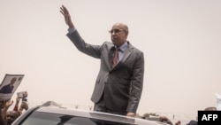Mohamed Ould Cheikh El Ghazouani, president of Mauritania and leader of the Union for the Republic, waves to supporters celebrating his reelection in Nouakchott on July 01, 2024.