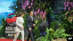 Indonesian President Joko Widodo, right, walks with U.S. Vice President Kamala Harris upon her arrival to attend the Association of Southeast Asian Nations (ASEAN) Summit in Jakarta, Indonesia, Sept. 6, 2023.