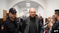 FILE - Russian opposition activist Vladimir Kara-Murza is escorted for a hearing at the Basmanny court in Moscow, Oct. 10, 2022.