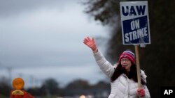 General Motors' Spring Hill union employee Mary Beth Gervais walks the picket line near the plant in Spring Hill, Tennessee, Oct. 30, 2023. 