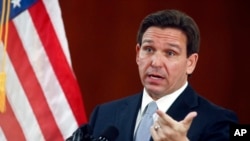FILE - Florida Governor Ron DeSantis answers questions in Tallahassee, Florida, March 7, 2023. DeSantis has signed a law that places severe restrictions on the ability of some non-U.S. citizens to purchase property in Florida.