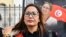 FILE - Chaima Issa, member of Tunisia's "National Salvation Front" opposition coalition, looks on as she arrives outside a military court in Tunis on Oct. 3, 2023.