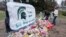 FILE - Mourners leave flowers at The Rock on the grounds of Michigan State University in East Lansing, Mich., Feb. 15, 2023. 