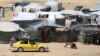 Displaced Palestinians transport their belonging atop a car as they flee to a safer area in Rafah in the southern Gaza Strip on May 9, 2024. 