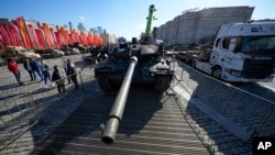 A German-made Leopard 2A6 tank, hit and captured by Russian troops during fighting in Ukraine, sits on display in Moscow, May 1, 2024. An exhibition of military equipment captured from Kyiv forces has opened in the Russian capital. 