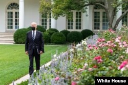 President Biden walks through the White House Rose Garden. (The White House)