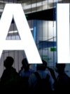 FILE - An AI (artificial intelligence) sign is seen at the World Artificial Intelligence Conference in Shanghai, China July 6, 2023.