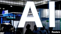 FILE - An AI sign is seen at the World Artificial Intelligence Conference in Shanghai, China, July 6, 2023. The media watchdog NewsGuard is reporting a jump in websites designed to look like news sites, but filled with AI-generated content.
