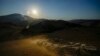 Sheep are released to graze as the sun sets and temperatures go down, at the Liborio Mangiapane farm, in Cammarata central Sicily, Italy, July 18, 2024. 