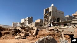 Flooding aftermath is seen in Derna, Libya, Sept.14, 2023. Teams are combing streets, wrecked buildings, and even the sea to look for bodies in Derna, where the collapse of two dams unleashed a massive flash flood that killed thousands of people.