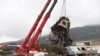 Cranes remove debris after a trains' collision in Tempe, about 376 kilometres (235 miles) north of Athens, near Larissa city, Greece, March 2, 2023. 