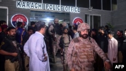 FILE - Paramilitary soldiers leave a police compound after taking control of the building following an attack by Pakistani Taliban fighters, in Karachi, Pakistan, Feb. 17, 2023. 