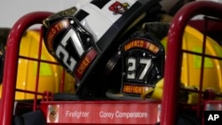 Helmets rest on the locker of firefighter Corey Comperatore at the Buffalo Township Fire Company 27, in Buffalo Township, Pennsylvania, July 14, 2024.