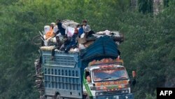 Afghan refugees arrive in trucks to cross the Pakistan-Afghanistan border in Torkham.&nbsp;Islamabad has given Afghans it has deemed to be living illegally in Pakistan until November 1 to leave voluntarily or face deportation &mdash; an order the Taliban government says amounts to harassment.&nbsp;