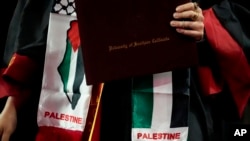 Palestinian symbols are seen on the stole of a graduate during commencement for the University of Southern California's Viterbi School of Engineering, May 10, 2024, in Los Angeles. 
