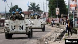 (FILE) Peacekeepers serving in MONUSCO patrol in December 2016.