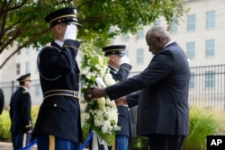 Secretary of Defense Lloyd Austin hosts an observance ceremony at the National 9/11 Pentagon Memorial in honor of the 184 people killed in the 2001 terrorist attack on the Pentagon, Sept. 11, 2023, in Washington.