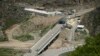 FILE - A bridge and a checkpoint are seen on a road towards the separatist region of Nagorno-Karabakh in Armenia, July 28, 2023. 