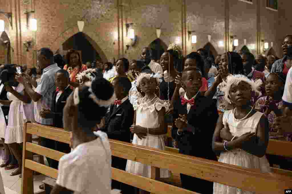 Worshippers attend a Christmas Mass at our Lady of the Congo Cathedral in Kinshasa on December 24, 2023.