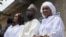 FILE—Presidential candidate for the Diomaye President coalition Bassirou Diomaye Faye (C), and his wives Marie Khone Faye (L) and Absa Faye (R) in Ndiaganiao on March 24, 2024 during Senegal's presidential elections.
