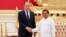 FILE - In this handout photo released by Russian Foreign Ministry Press Service, Myanmar State Administration Council Chairman Senior General Min Aung Hlaing, right, and Russian Foreign Minister Sergey Lavrov pose during their meeting in Naypyitaw, Myanmar, Aug. 3, 2022.