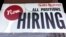 FILE - File - A hiring sign is displayed at a restaurant in Rolling Meadows, Ill., Dec. 27, 2022. On Thursday, the Labor Department reports on the number of people who applied for unemployment benefits last week. 
