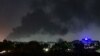 Smoke rises above buildings in Khartoum on May 19, 2023, as violence between two rival Sudanese generals continues.