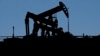 FILE - Pumpjacks dip their heads to extract oil in a basin south of Duchesne, Utah, on July 13, 2023. 