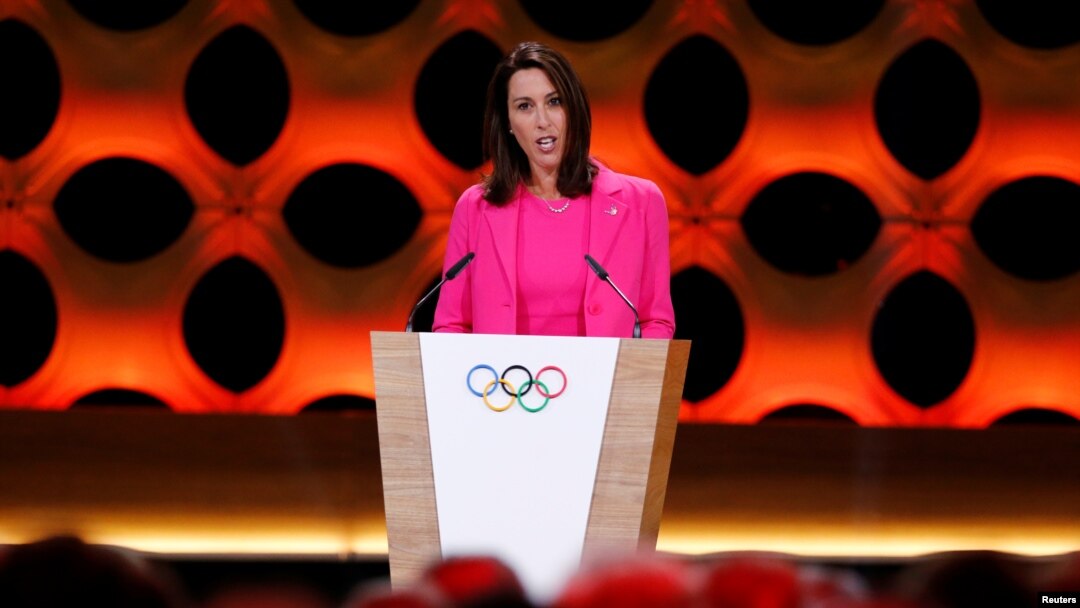 FILE - Janet Evans, Olympic swimming champion and chief athlete officer for LA2028, speaks at the presentation of Los Angeles 2028 at the 131st IOC session in Lima, Peru, Sept. 13, 2017.