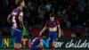 FILE - Barcelona players react at the end of the Champions League quarterfinal second leg soccer match between Barcelona and Paris Saint-Germain at the Olimpic Lluis Companys stadium in Barcelona, Spain, April 16, 2024.