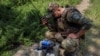FILE - A Ukrainian serviceman prepares a first-person view (FPV) drone before flying it over positions of Russian troops, amid Russia's attacks on its neighbor, in Ukraine's Kharkiv region, May 25, 2024.