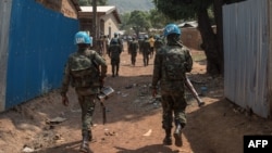 FILE - U.N. Multidimensional Integrated Stabilization Mission in the Central African Republic (MINUSCA) soldiers patrol near the C.A.R. capital of Bangui, Jan. 13, 2021. Several hundred rebels are reported have surrendered to government troops and U.N. forces in recent weeks.