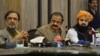 Pakistan Interior Minister Rana Sanaullah, center, listens to a question during a press conference in Islamabad, May 24, 2022.