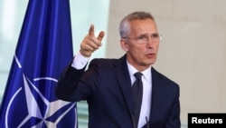 NATO Secretary General Jens Stoltenberg gestures during a press conference at the chancellery in Berlin, Germany, June 19, 2023. 