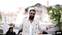 Sudanese director Mohamed Kordofani poses during a photocall for the film "Goodbye Julia" at the 76th edition of the Cannes Film Festival in Cannes, southern France, on May 21, 2023. 