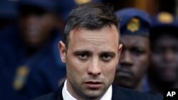 FILE - Oscar Pistorius leaves the High Court in Pretoria, South Africa, on June 15, 2016, after his sentencing proceedings. 